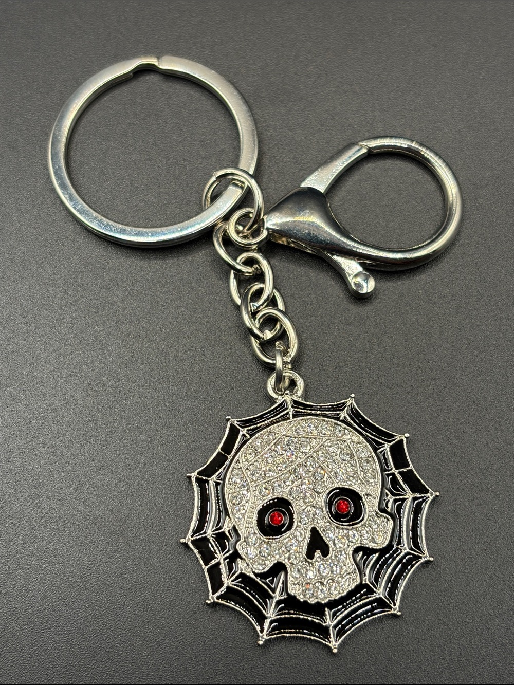 Silver Skull & Web Keychain with Red Eyes